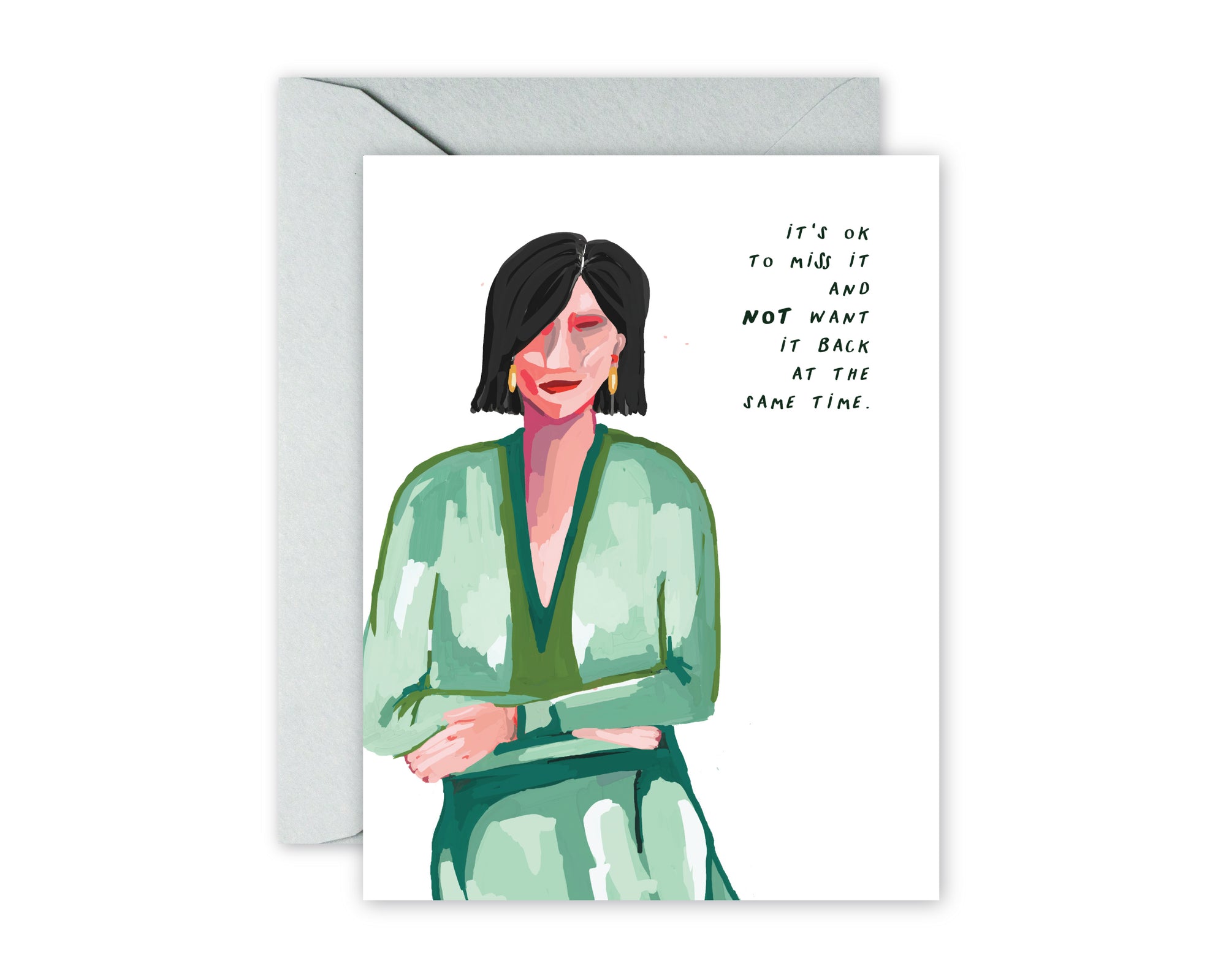 Greeting card with illustrated woman with dark bob, green print dress. And the saying IT'S OK TO MISS IT AND NOT WANT IT BACK AT THE SAME TIME. Grey envelope