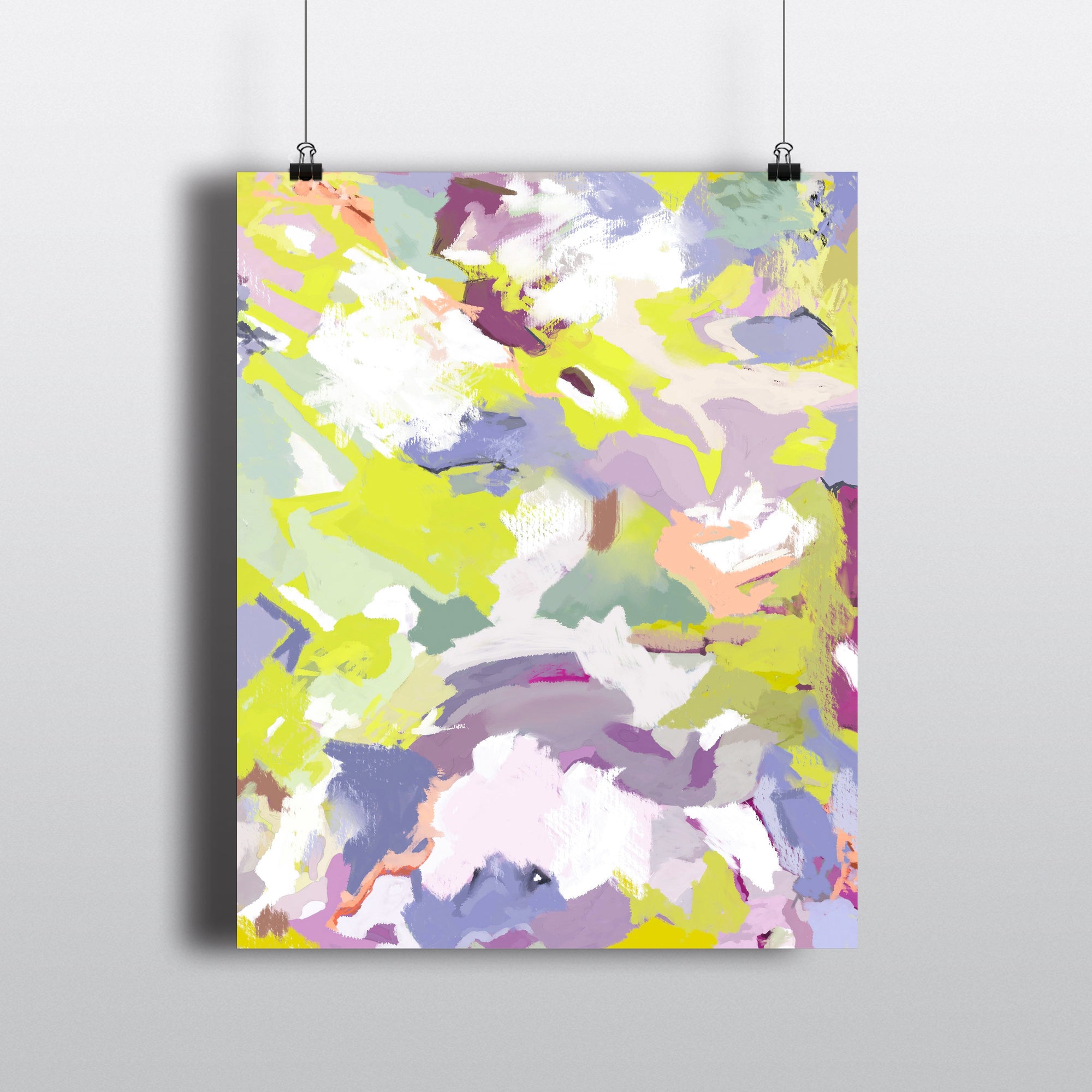 Abstract art print in chartreuse, lilac, and peach tones. On hanging clips.