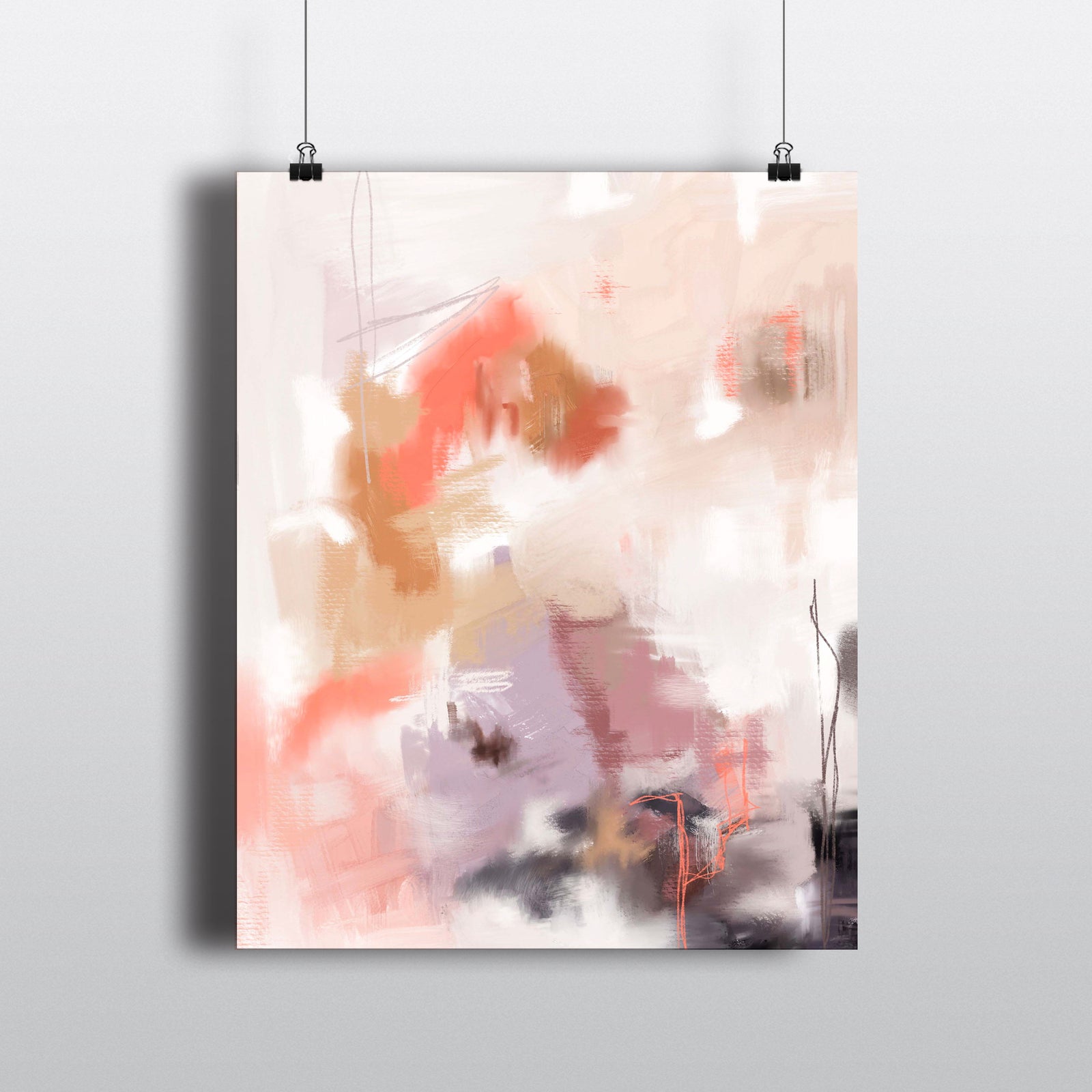 Abstract art print in shades of coral, tan and purple hanging from clips.
