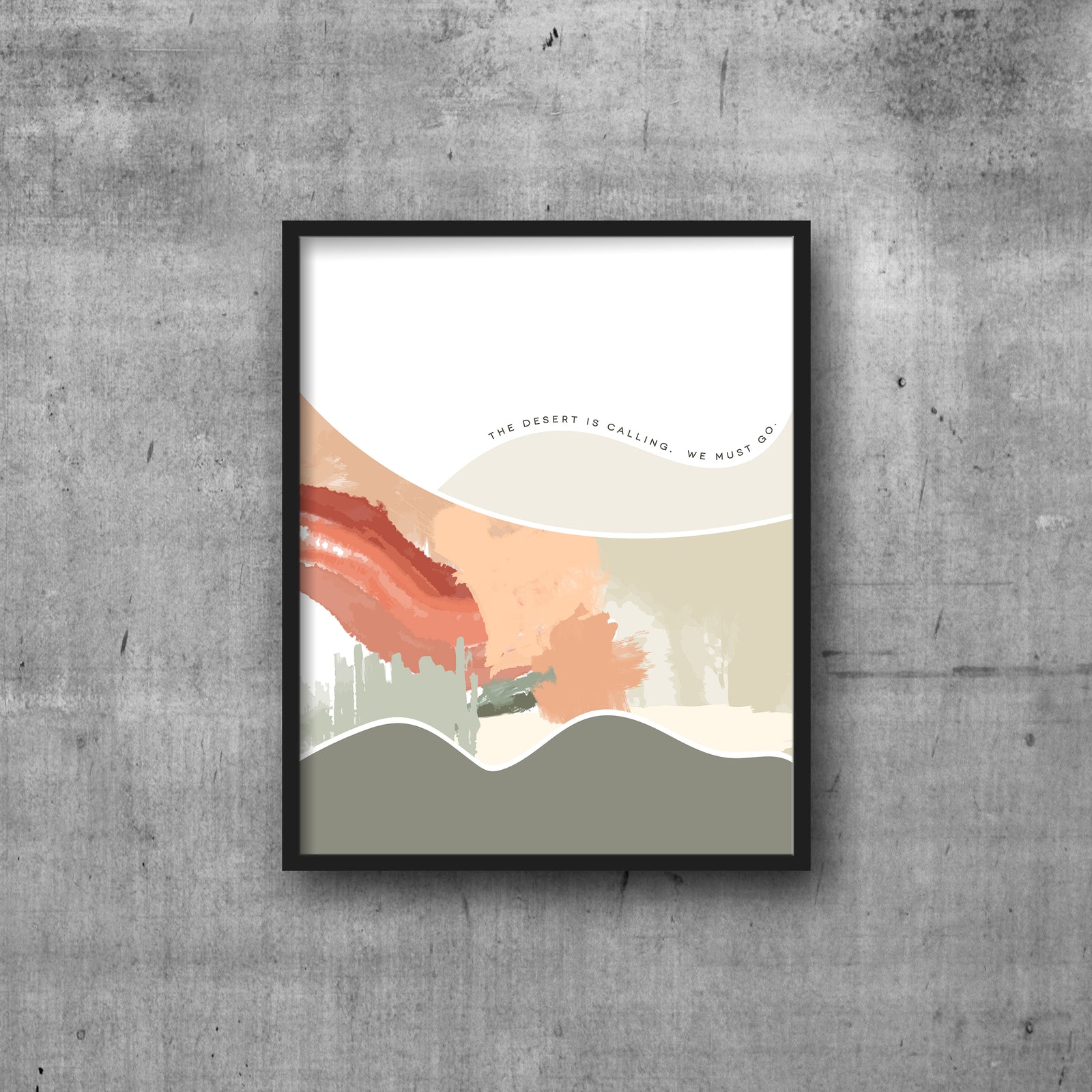 Abstract modern art print with text THE DESERT IS CALLING. WE MUST GO.  Hanging by clips.