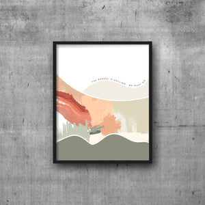 Abstract modern art print with text THE DESERT IS CALLING. WE MUST GO.  In black frame.