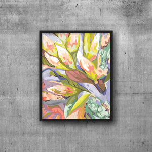 Abstract floral art print in shades of coral, mint lilac and chartreuse. In black frame on cement wall.
